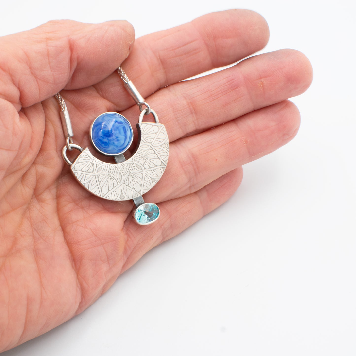 Blue Swirl and Topaz CZ Necklace